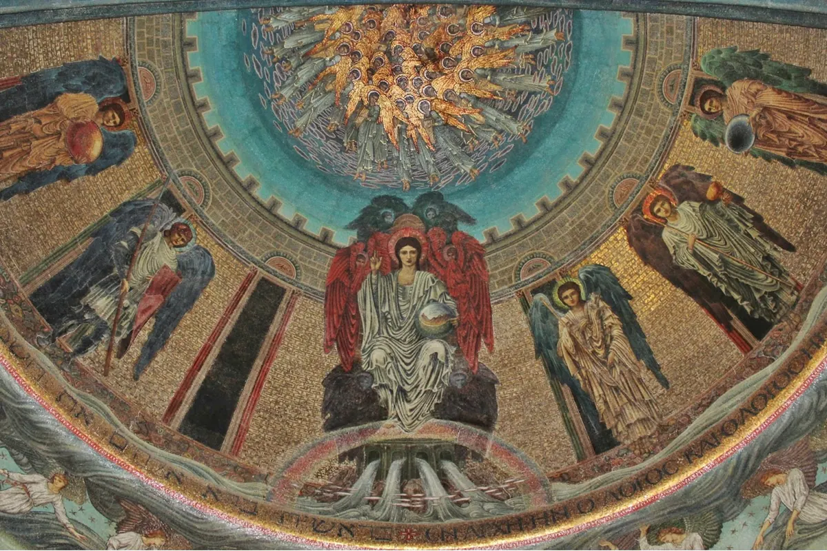 The apse mosaic by Edward Burne-Jones, with a robed Christ seated on a throne between archangels beneath a ring of golden angels.